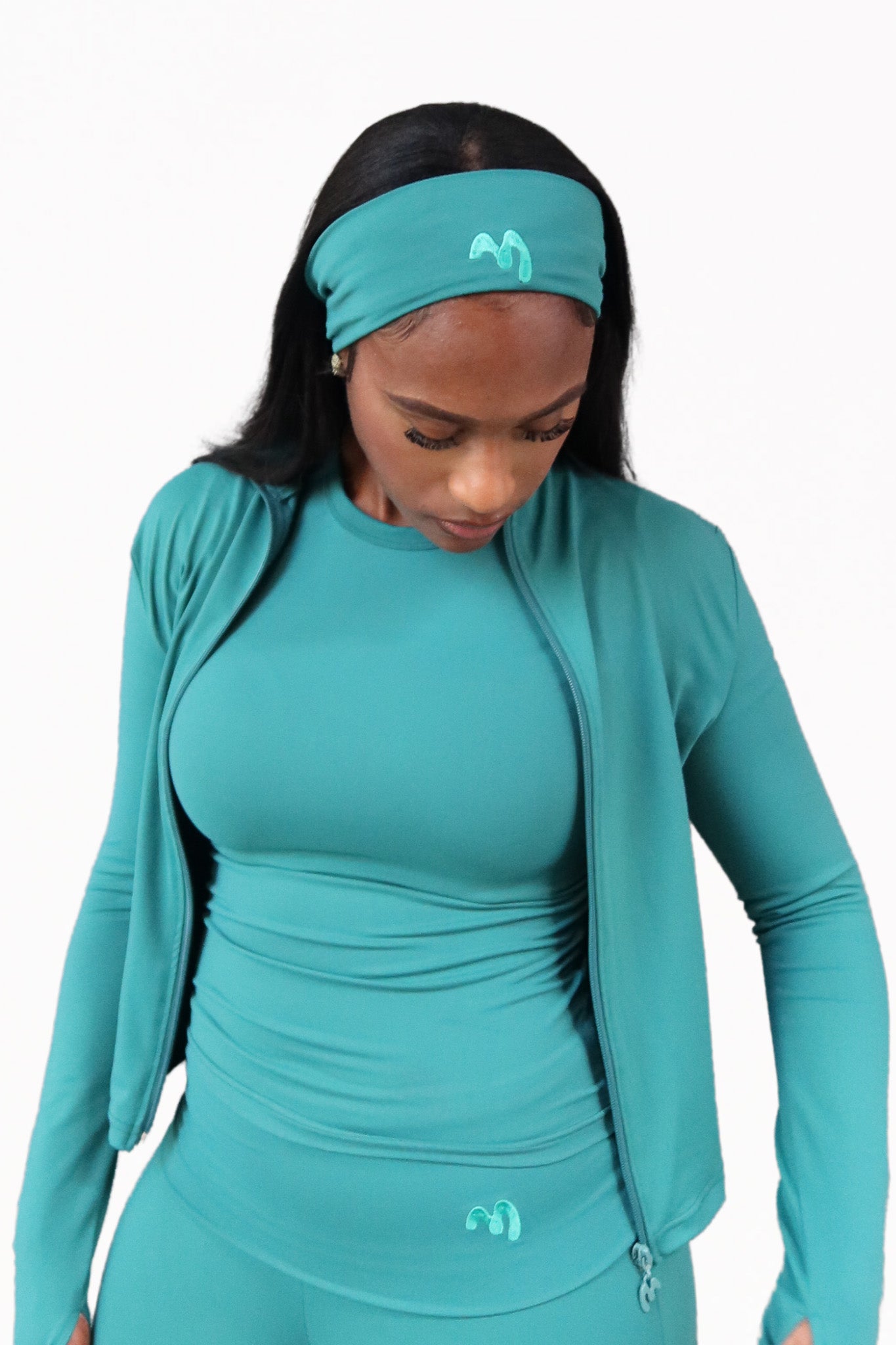 Green women's headband that is stretchy, sweat-resistant and perfect for workouts.
